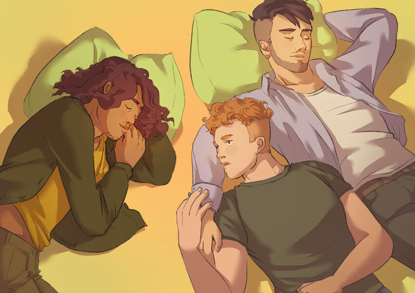 Tamir, Jan and Liam lying on the floor with some cushions.